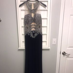 Beautiful beaded illusion gown with key hole cut out back